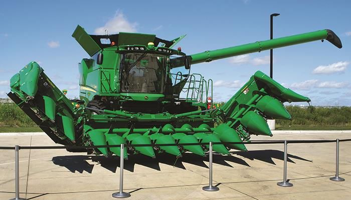 Workhorse 4-track tractor, folding corn head highlight new John Deere products