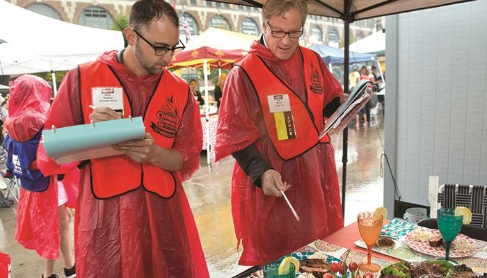 Celebrity judges Scott Siepker and Ed Wilson at Iowa Farm Bureau's Cookout Contest at the Iowa State Fair