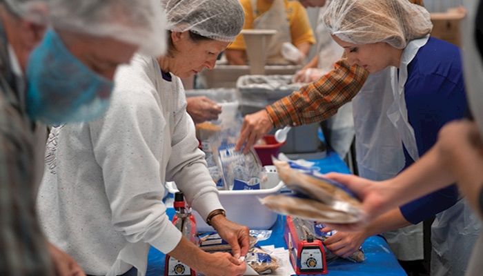 Volunteers package food at the 2014 Iowa Hunger Summit