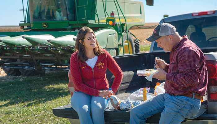 Matt Werner grabs a quick lunch with his wife, Andrea, as he hustled to finish harvesting corn on his farm near Mount Auburn in Benton County. PHOTO / GARY FANDEL