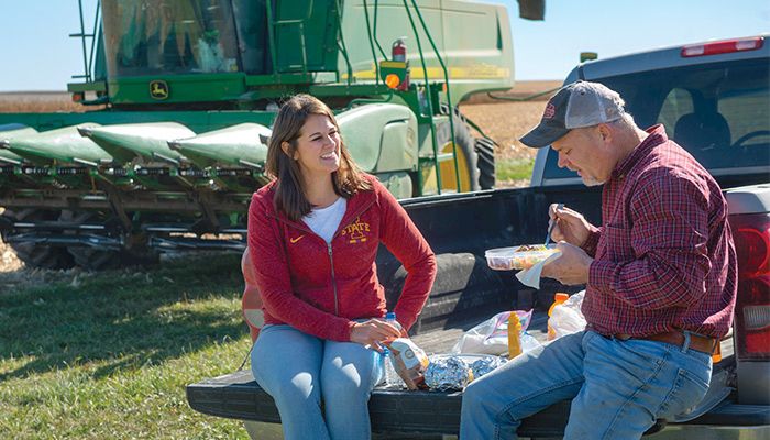 Matt Werner grabs a quick lunch with his wife, Andrea, as he hustled to finish harvesting corn on his farm near Mount Auburn in Benton County. PHOTO / GARY FANDEL