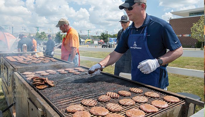 hris Schreck, right, and Terry Kestner, both of Cedar Falls, cook pork burgers at the Big Grill during the Word Pork Expo last week at the Iowa State Fairgrounds in Des Moines. The free lunch is always a big attraction at the World Pork Expo