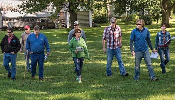 Calhoun County Soil and Water Conservation commissioners toured the future site of an urban bioretention cell that will filter storm water along a residential street in Lohrville. 