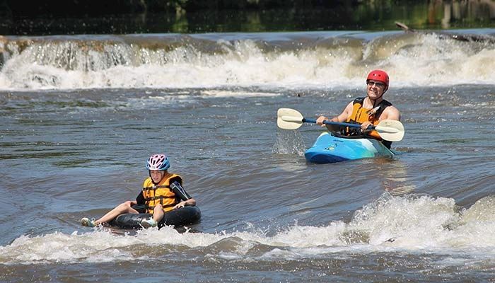Paddlers take on the waves at the new whitewater park in Manchester. 