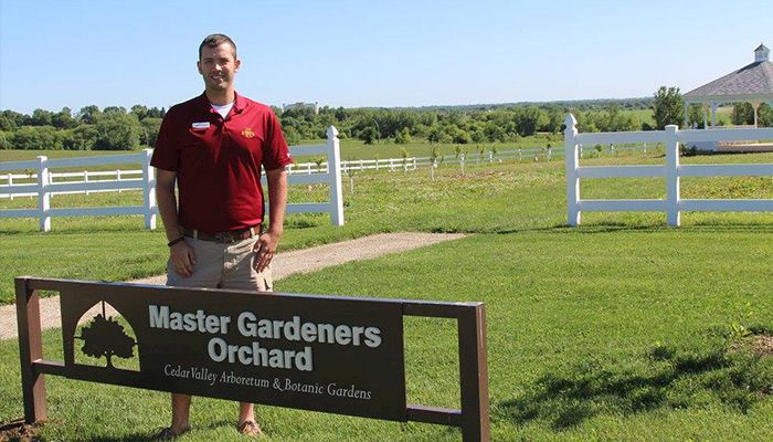 Justin Edwards, with Black Hawk County Extension, checks in on the new Master Gardeners Orchard at the Cedar Valley Arboretum in Waterloo.