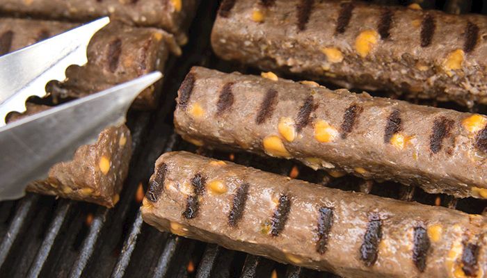 The JoKir's Wild Beef cheddar jalapeno CYburdog is made with Iowa-grown premium Black Angus ground beef and goes great with a tailgate party or summer cookout.