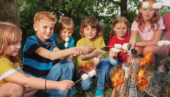 Plan outdoor activities, such as camping trips, to encourage kids to spend more time in nature and less time on screens this summer.