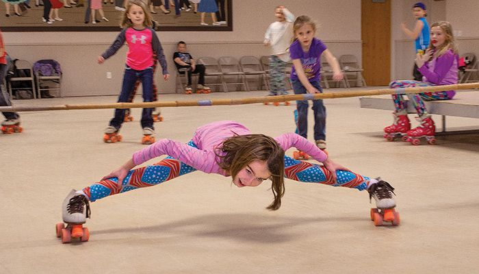 Young skaters escape the winter weather with a family skate night at Memorial Hall in Elma. Pig farmer and Farm Bureau member Trent Thiele and his wife, Kris, manage the skating center as a way to give back to their community.