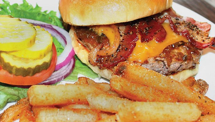 The 2019 Iowa's Best Burger is a custom blend of ground chuck and short rib topped with applewood smoked cheddar, uncured peppered bacon and house specialty jalapeno onion jam.
