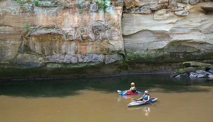 Kayakers glide along the Raccoon River at Hanging Rock Park near Redfield in Dallas County. 