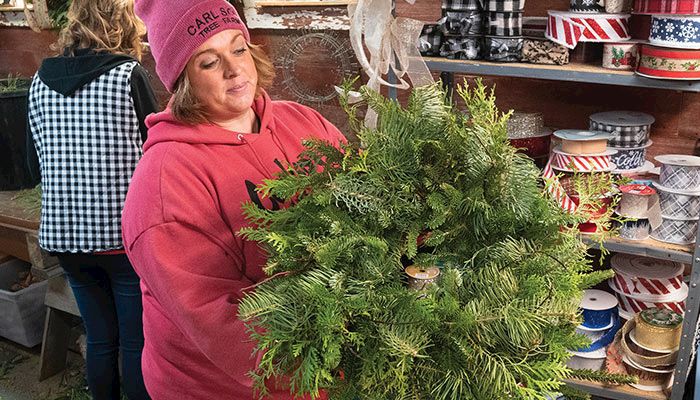Choose from a wide selection of colorful holiday wreaths, or make your own, at Carlson Tree Farm in Hampton.