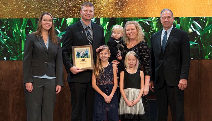 Dustin Johnson of Clinton County presented Iowa Farm Bureau Young Farmer Achievement Award 