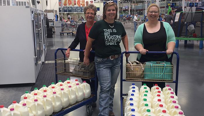 Iowa Department of Agriculture and Land Stewardship employees donate milk to the Food Bank of Iowa.