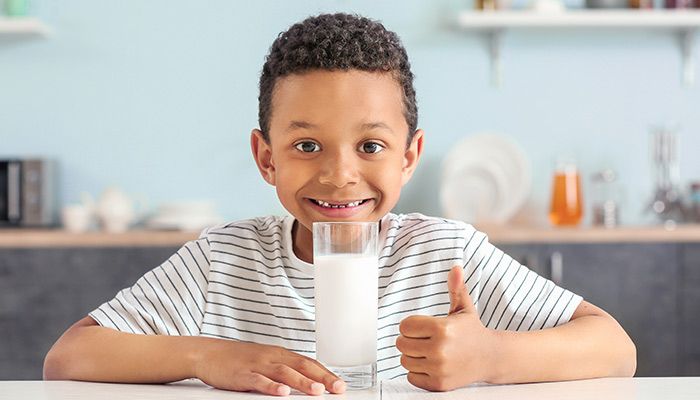 kid with milk