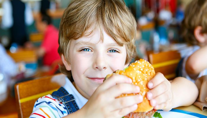 kid eating burger