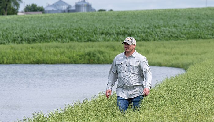 Hunter Slifka checks out the progress of a wetland project 