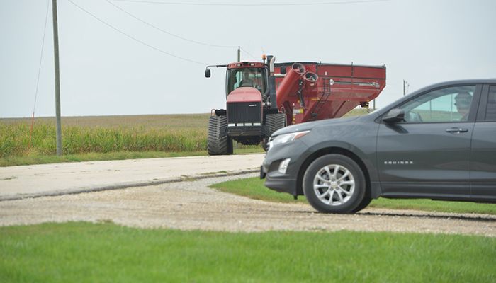 Tractor and car at intersection