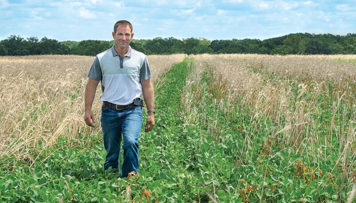 Jarad Weber standing in soybeans and cover crop