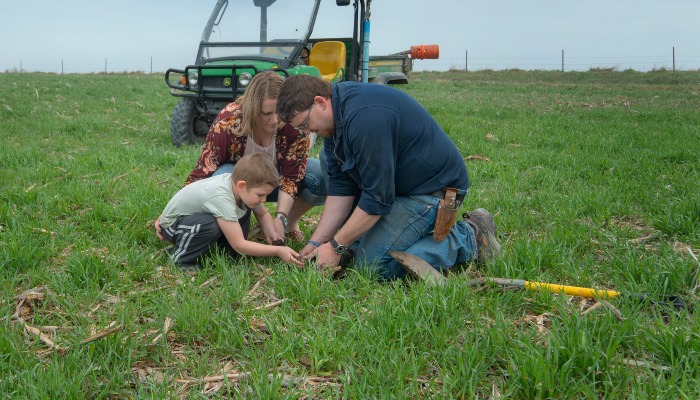 Mike Jackson and family in field of cover crops