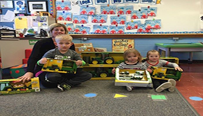 Local students receive farm toys