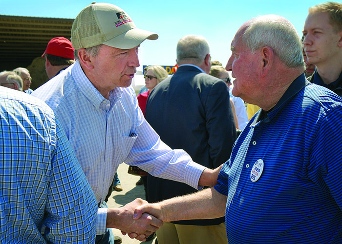 Iowa Farm Bureau President Craig Hill greets U.S. Agriculture Secretary Sonny Perdue