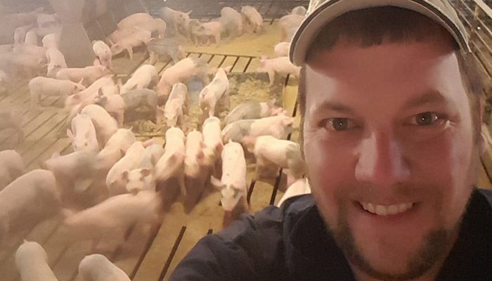 Jason in his pig barn 