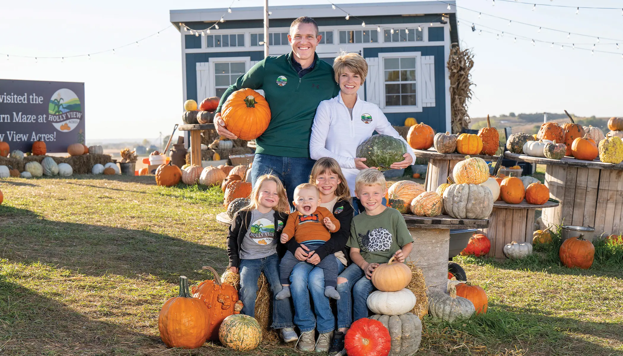 A farm family with pumpkins