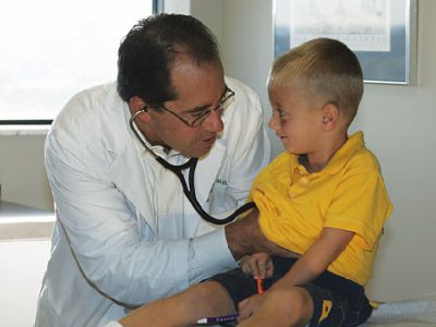 Pediatrician performing a check up.